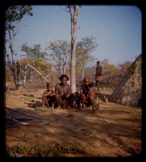 Coutimwe and Sambim sitting with three children