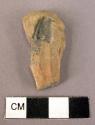 Ceramic sherd, red, from figurine or handle, grooved, flat 1 side, chipped