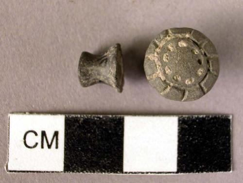 2 pottery studs, one with incised designs