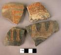 17 gray or black burnished potsherds with incised or incised & punched designs,