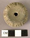 Pottery spindle whorl with incised and colored designs