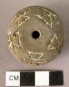 Pottery spindle whorl with incised and colored designs