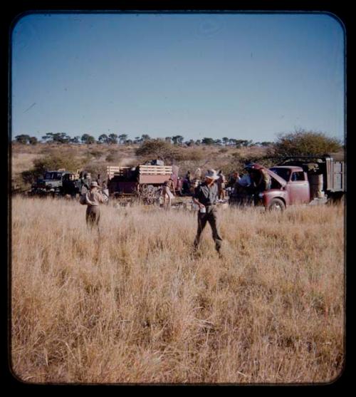 Expedition: Expedition members gathered near trucks and gear