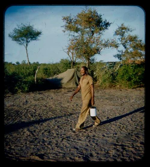 Expedition: Expedition member carrying a bucket