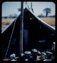 Expedition: Laurence Marshall standing inside a tent