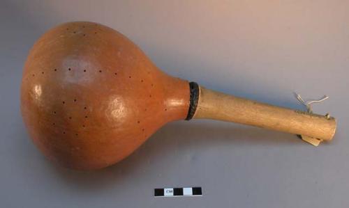 Gourd rattle, handle attached with gum from creosote bush