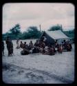 Expedition: Group of people sitting in front of a tent