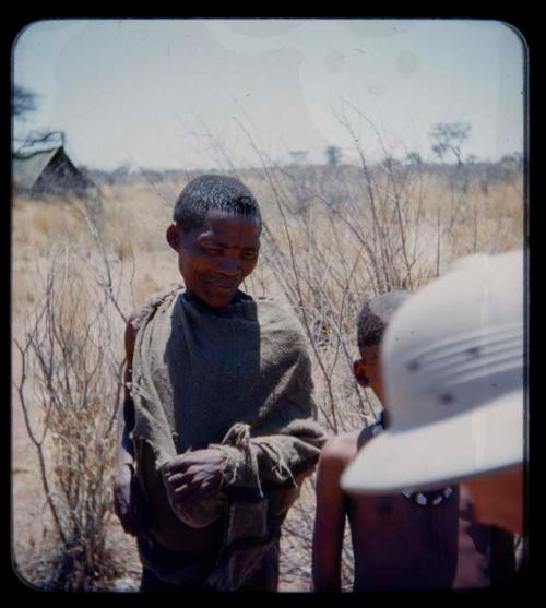 Expedition: Man and a boy standing, with a tent in the background