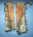 Pair of old deerskin leggings rubbed with red pigment