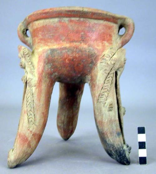 Pottery dish, tripod, colored, legs hollow and carved