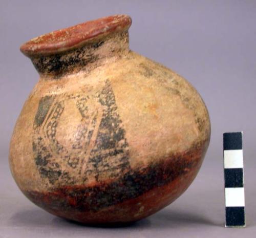 Pottery jar, base red, upper zone white with black ornamentation