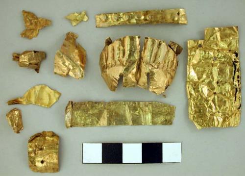 Pieces of thin gold plate with design