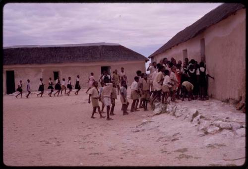 Boys and girls entering a school