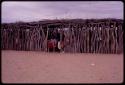 Students beginning to do school work in a tanning shed used as an auxiliary classroom by a school