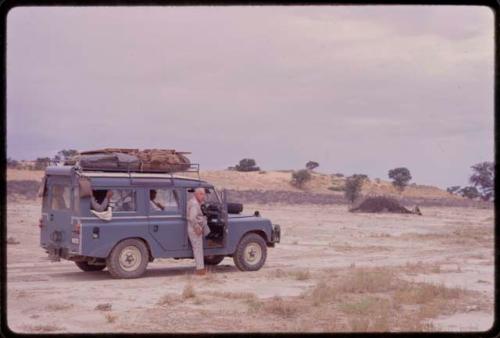 Laurence Marshall standing next to the expedition Land Rover