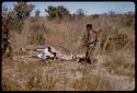 Gai and Oukwane standing over a dead gemsbok