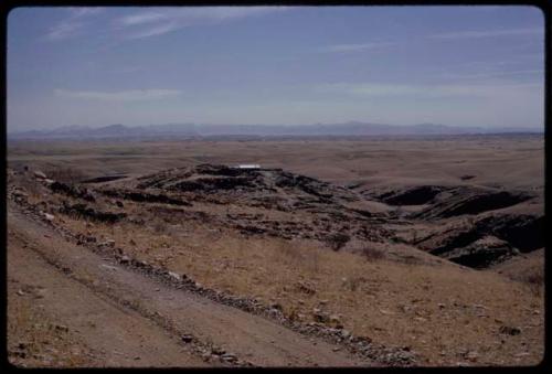 Landscape, road and farmhouse in the distance