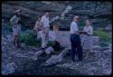 Lorna Marshall standing with four people at a water reservoir