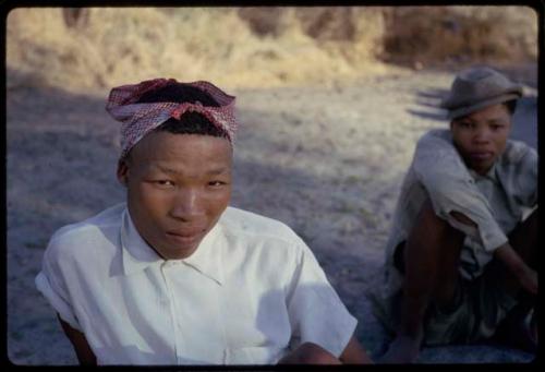 Two boys sitting, close-up view