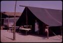 Beryl McIntyre standing under a tent