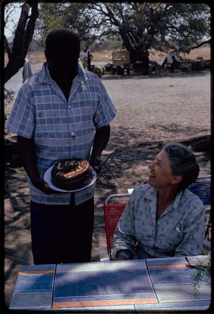 Philip Hameva presenting Lorna Marshall with a birthday cake