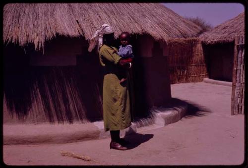 Kernel Ledimo's wife holding a child