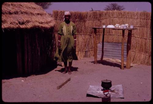 Kernel Ledimo's wife standing in her kitchen area