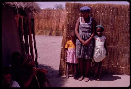 Women and children by Kernel Ledimo's house