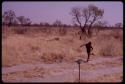 Boy running along the road which leads to ǂToma's land