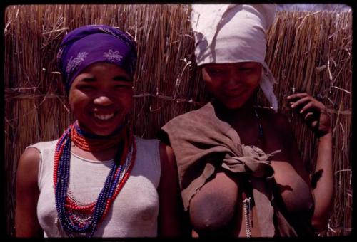 N!ai and "ǂGao Lame"'s wife standing, close-up