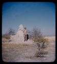 Expedition: J. O. Brew standing by anthill