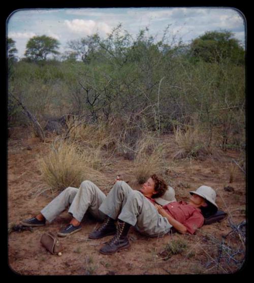 Expedition: Elizabeth Marshall Thomas and Lorna Marshall lying down and resting on their trip to Kubi