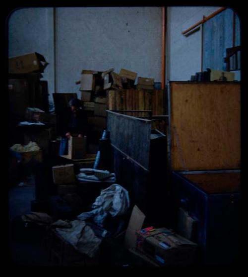 Expedition: Person looking through a box at a warehouse