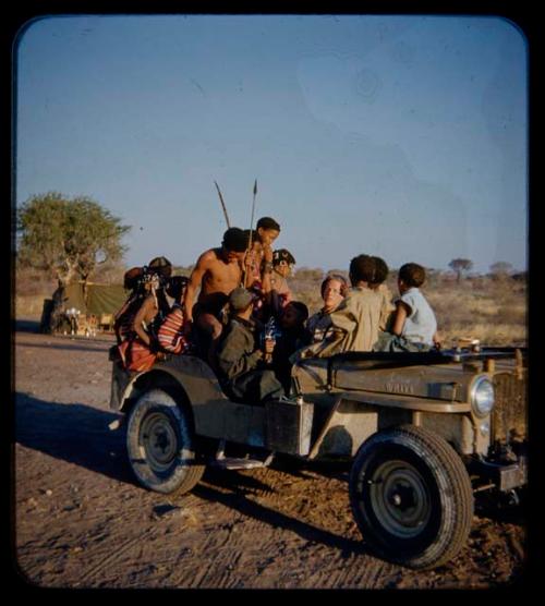 Expedition: Ngani, //Ao and others riding with John Marshall in the expedition Jeep