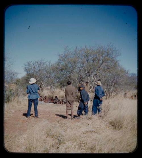 Expedition: Lorna Marshall photographing a group of people, with other expedition members present