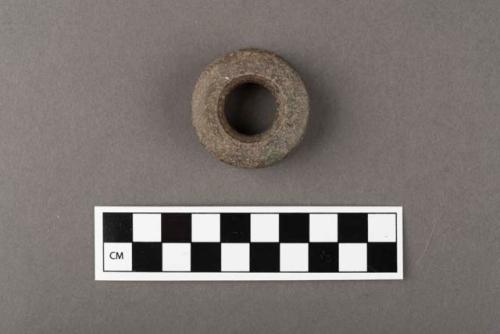 Ground stone; ornament; ear spool