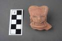 Red slipped pottery figurine head