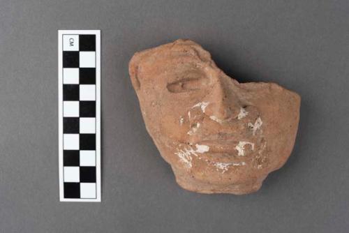 Pottery, human head, nose ornament