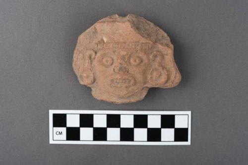 Pottery, human head, ear ornament