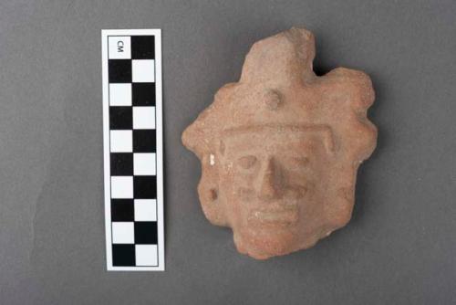 Pottery, human head, ear ornament