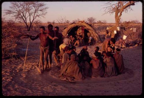 /Xoxa, /Gaishay and /'O/hei dancing around a group of women sitting at a curing dance