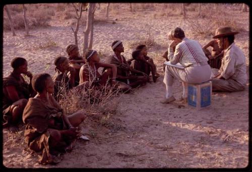 Lorna Marshall and Wilhelm Camm interviewing a group of people