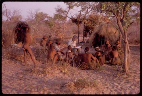 Lorna Marshall and Wilhelm Camm interviewing a group of people