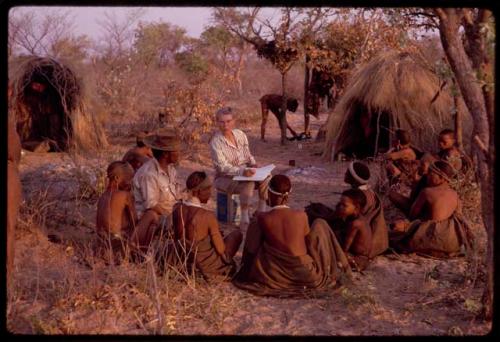 Lorna Marshall and Wilhelm Camm interviewing a group of people