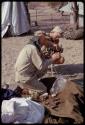 O.P.M. Prozesky and Wulf Haacke squatting and examining bats