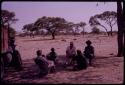 Expedition group gathered and talking with Mongabisi (Utukili's brother) in front of his house