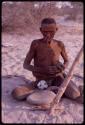 Elderly man who is blind, sitting at D/ao's werft