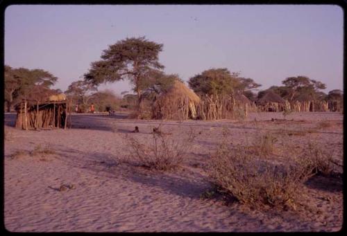 Distant view of huts across from Urobitsi's area