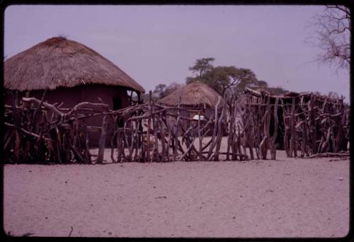 Old village with huts and fence, located next to "!O!Na"