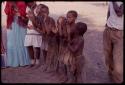 Women wearing "modern" Herero dress, with girls singing and clapping